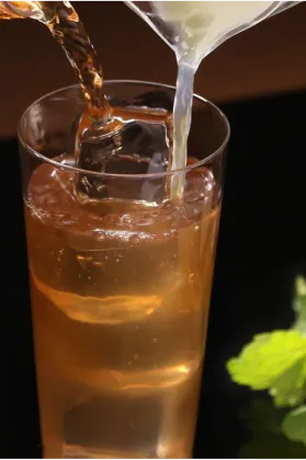 Serving glass tequila cocktail with lemon Sauza